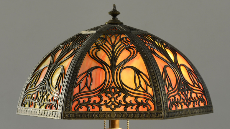 Vintage slag glass lamp with golden brown glass and black metalwork