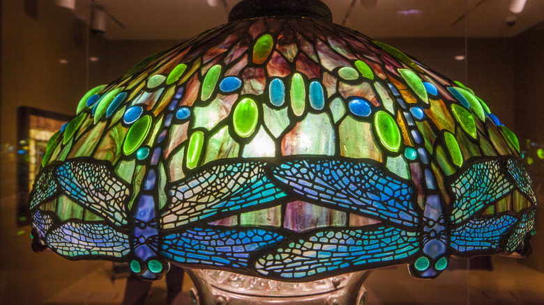 Tiffany stained glass lampshade with green and blue panels at the Art Institute of Chicago.