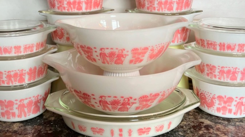 A large collection of Pyrex Butterprint pink on white bowls