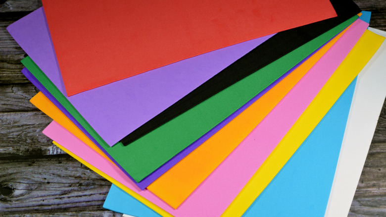 pile of colorful foam core board on wood background