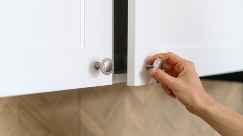 hand pulling cabinet knob