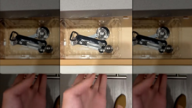 measuring spoons in a plastic berry container