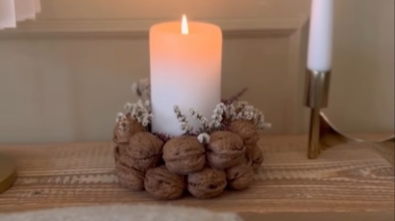 Walnut candle holder on a wood surface