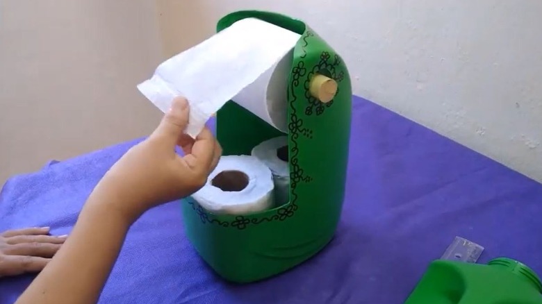 Detergent bottle turned into toilet paper storage solution