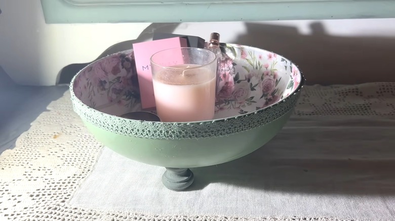 Frying pan upcycled into decorative floral bowl with lace, candles, and and chic decor