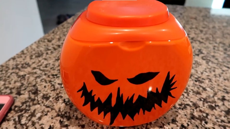 Laundry detergent bottle jack-o-lantern on counter