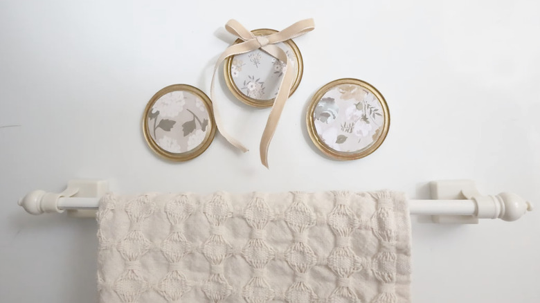 DIY jar lid magnets attached to the side of a refrigerator