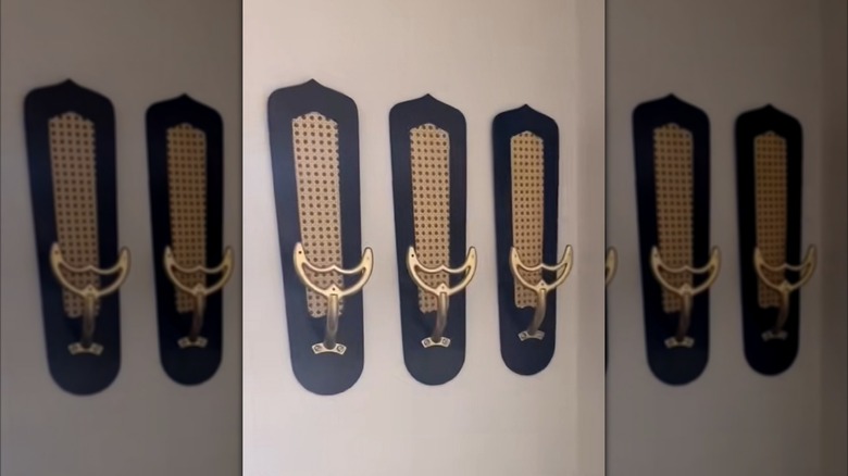 Retro ceiling fan blades mounted on wall as storage rack.