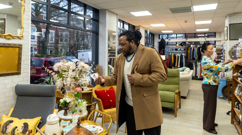 People browsing the home section of a thrift store