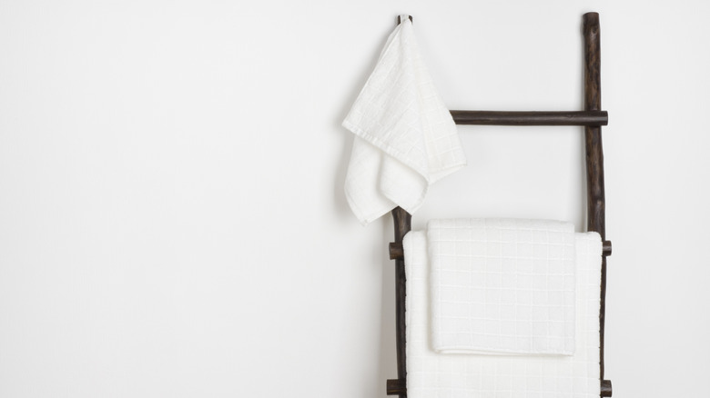 Towels hanging on vintage wooden ladder