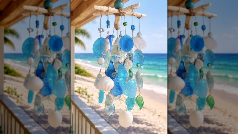 Closeup of beach glass, seashells, and glass held together by wire to create windchime.