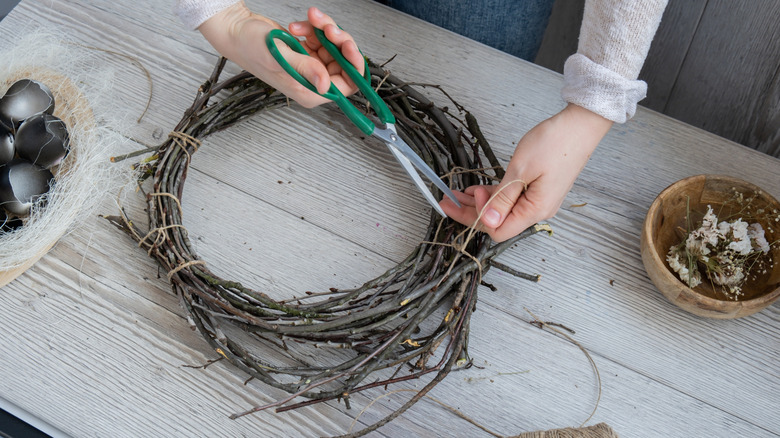 Someone crafting a wreath