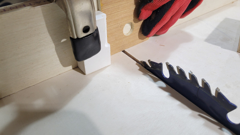 Cutting thumb slots in the shelves on a table saw crosscut sled