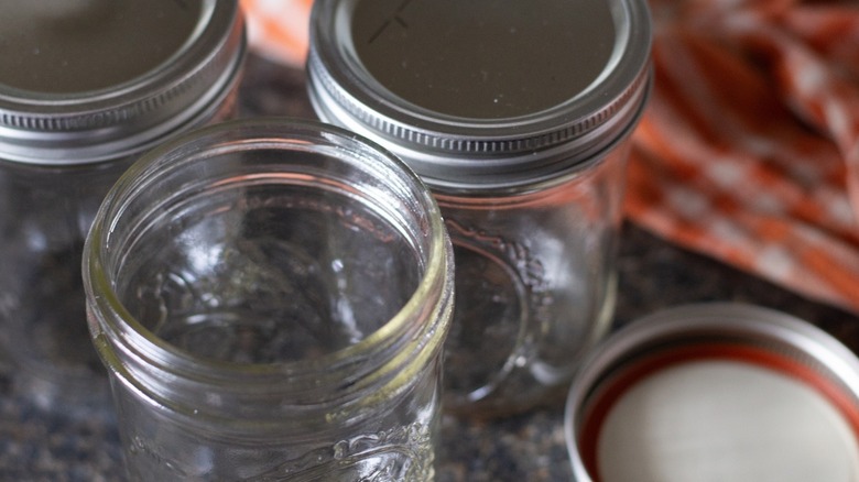 Three empty mason jars on a counter