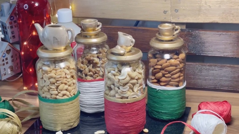 Dry fruits inside decorated glass jars with funky lids