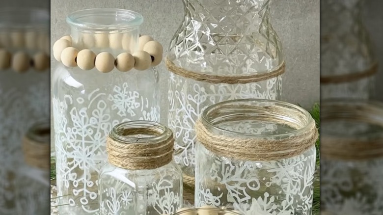Cool patterns drawn on glass jars of various heights