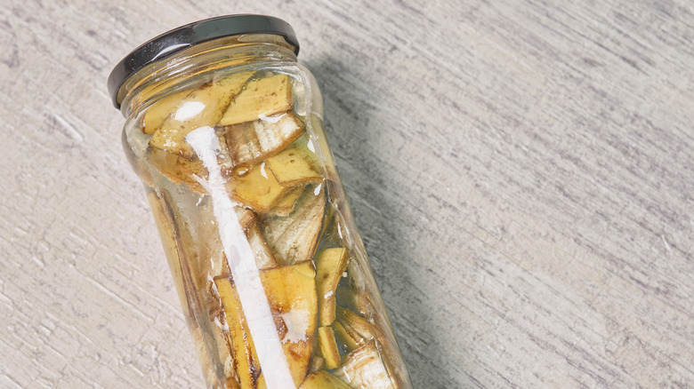 A glass filled with banana peel