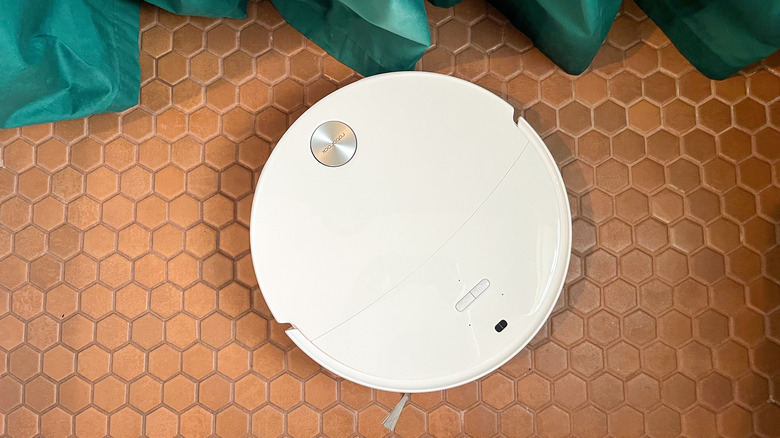 Roborock Qrevo Edge 3 Pro robot vacuum on terracotta penny tile