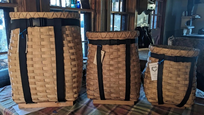 Three woven pack baskets in different sizes.