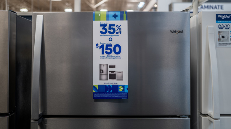a Whirlpool stainless steel refrigerator for sale in a store