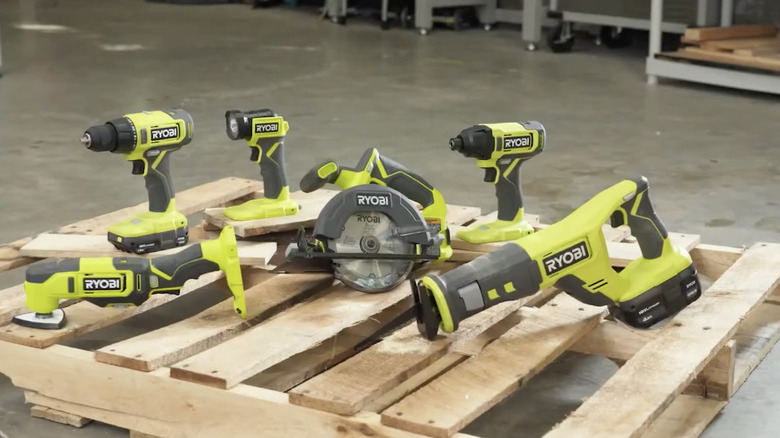 RYOBI ONE+ 18V Cordless 6-Tool Combo Kit on a wood pallet in a warehouse