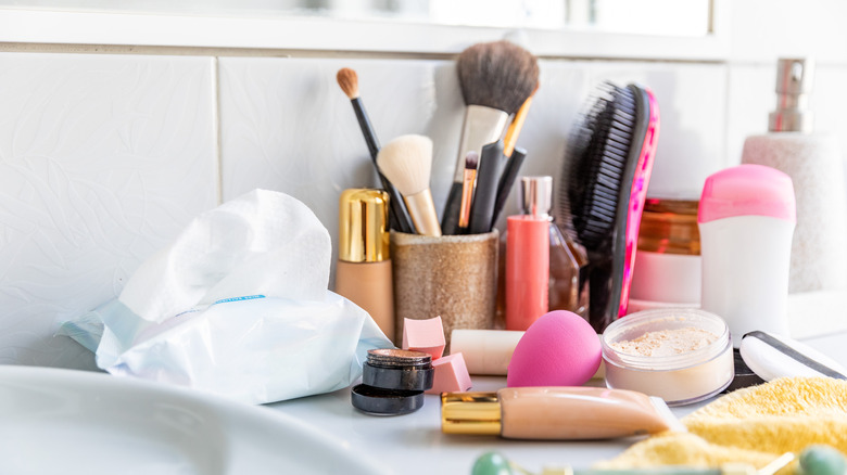Makeup and toiletries on a bathroom counter