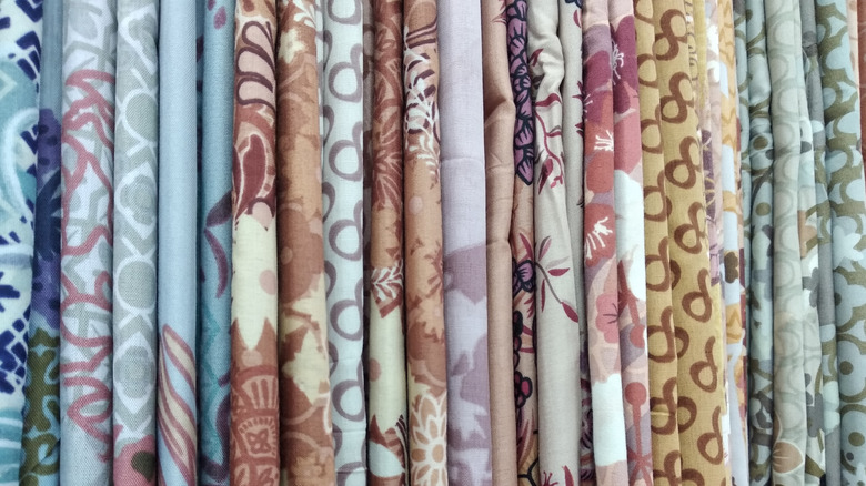 rows of veils and tapestries in a store