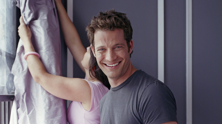 Nate Berkus smiling near a window