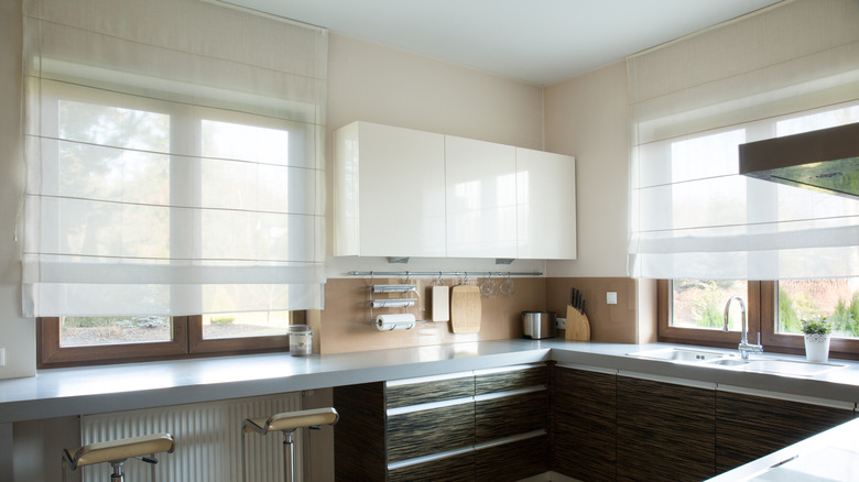 A modern kitchen with window shades