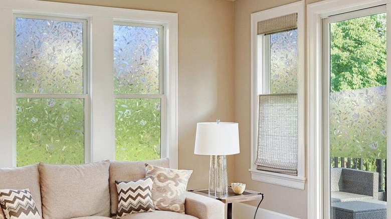 Prismatic window film is installed in a neutral living room
