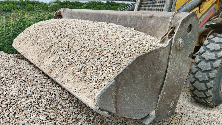 Crushed concrete being delivered in a front-end loader