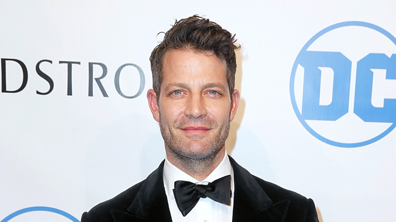 Nate Berkus smiling on red carpet at event