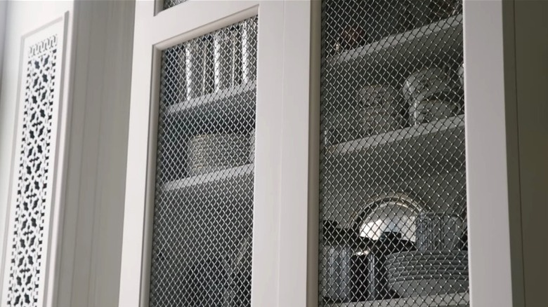 Wire mesh cabinet doors in Nate Berkus' home