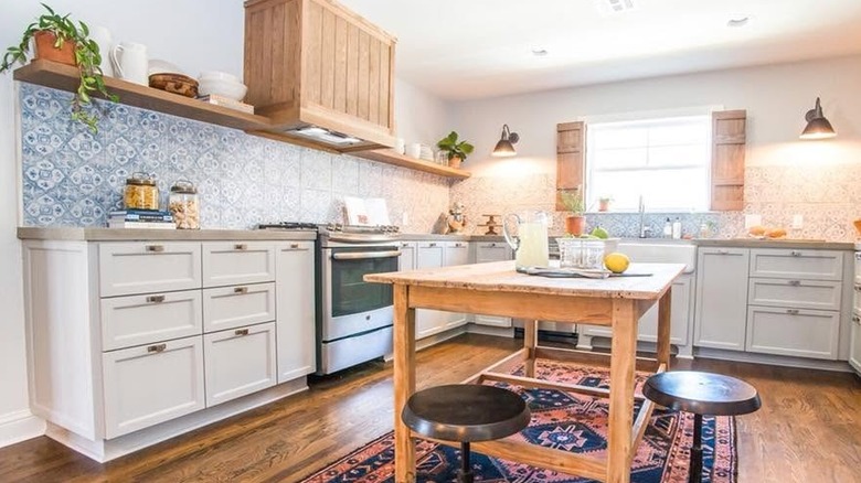 Kitchen with blue and white patterned backsplash tiles from "Fixer Upper" TV show