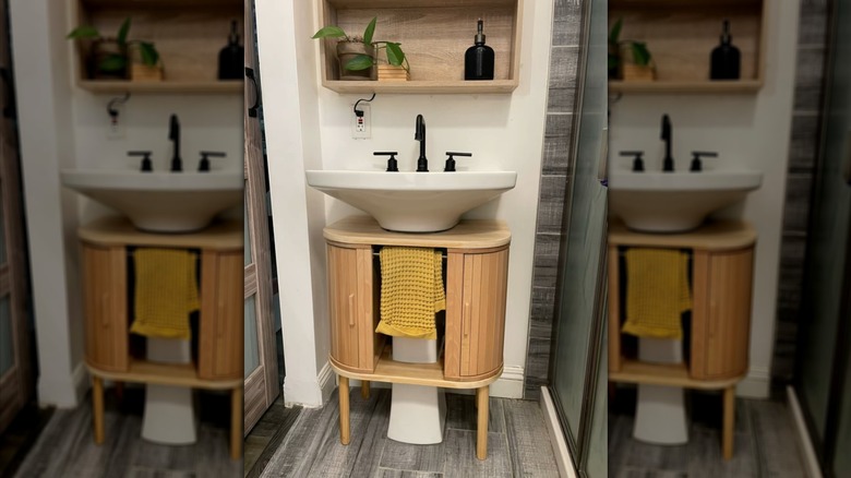 IKEA bread bins repurposed into a stylish vanity for a pedestal sink
