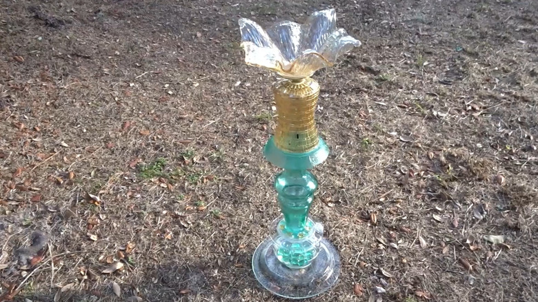 Assorted glass pieces stacked and glued to create a birdbath