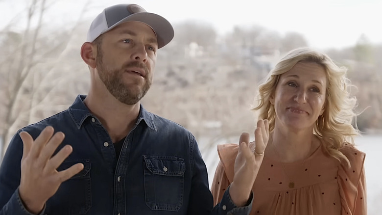Dave and Jenny Marrs explaining their modern home renovation outside