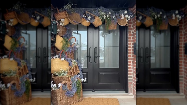A front door arch made up of woven baskets filled with flowers