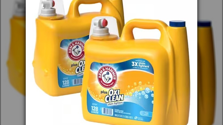 Yellow jugs of Arm & Hammer Plus Oxi Clean detergent