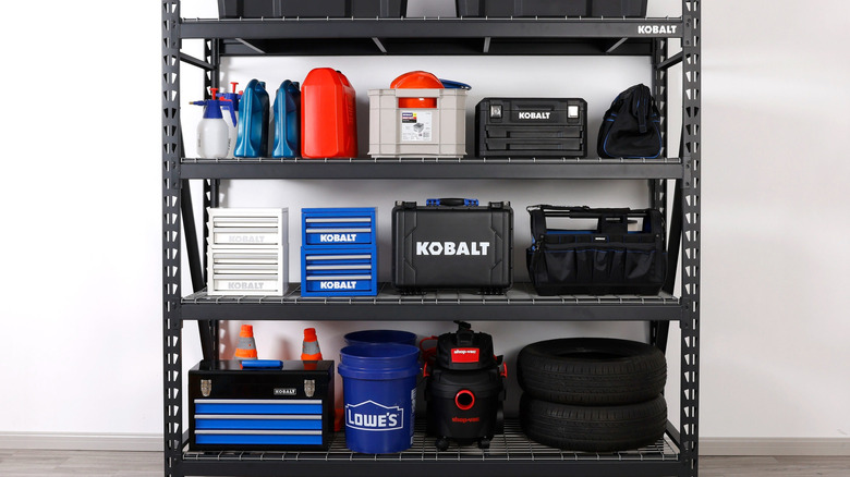 Lowe's 4-tier shelving unit with tools on the shelves