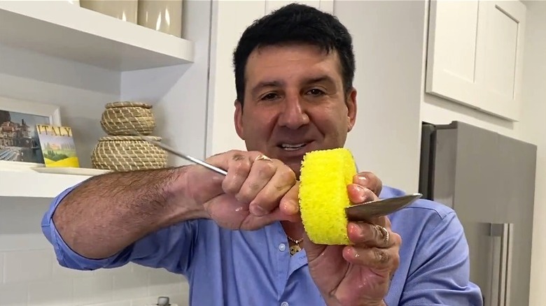 Aaron Krause showing off the cleaning ability of the Scrub Daddy's mouth when washing utensils