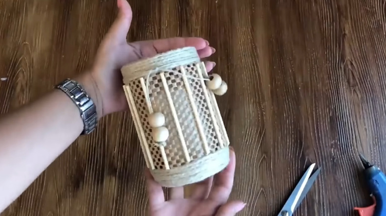A candle holder made from a pickle jar covered in non-slip material