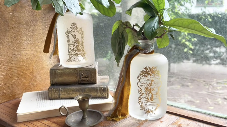 Glass bottles turned into DIY vintage frosted decor from YouTube channel Redesign with Prima