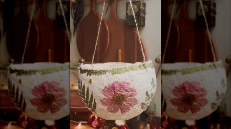 DIY hanging lantern made from balloon, tissue paper, and flowers