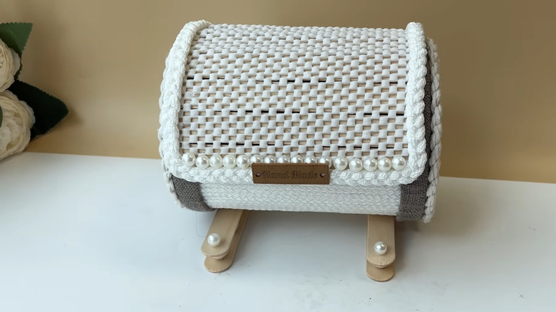 Decorative storage made from old jar lids and other materials