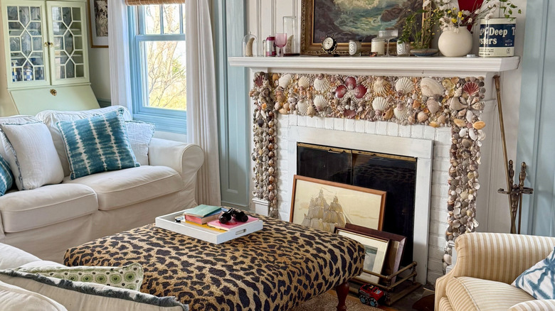 Fireplace with a mantel covered in seashells