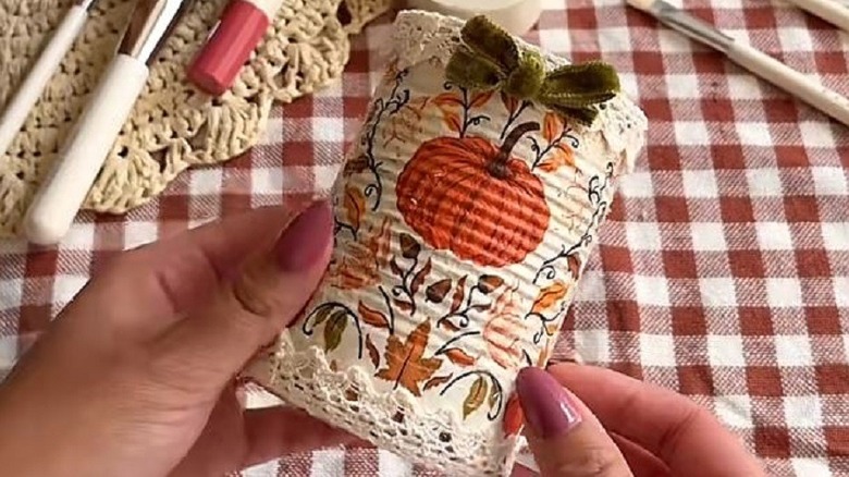 Tin can turned into fall decor using decoupage technique