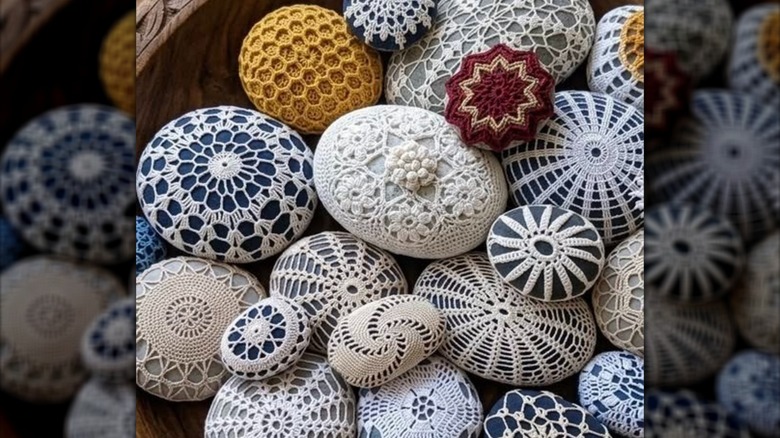 Assorted rocks covered in doilies sitting in a basket