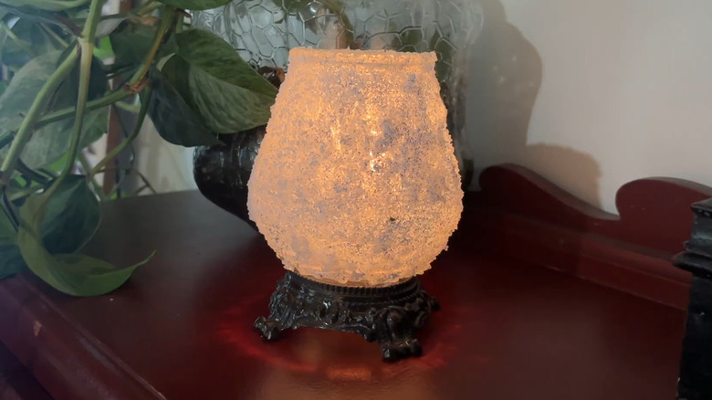 A frosted vase with a light glowing from inside