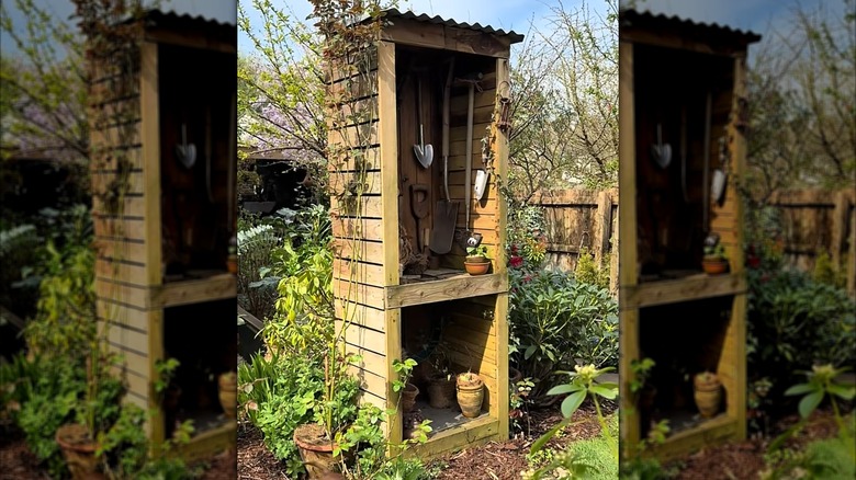 Tall vertical garden tool shed made of pallet wood